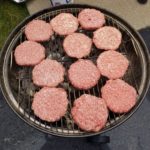 specialty plastic fabricators grilling burgers at team cook out