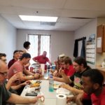specialty plastic fabricators team eating lunch in breakroom
