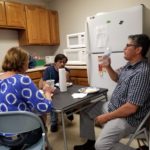 team at specialty plastic fabricators eating lunch in breakroom