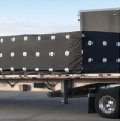Specialty created plastic cover for cargo on flatbed truck
